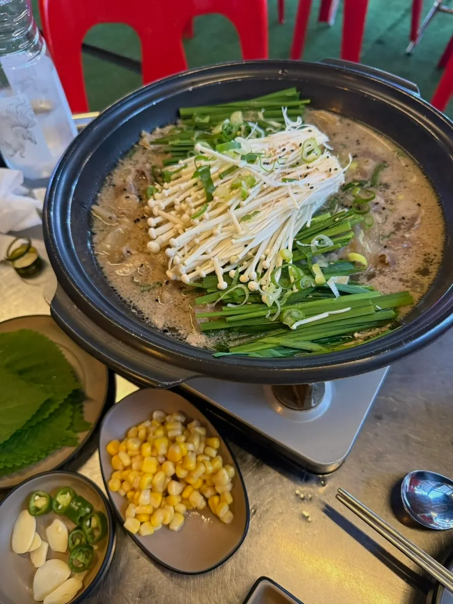 Perilla leaf wrap topped with meat, kimchi, corn, and mayonnaise