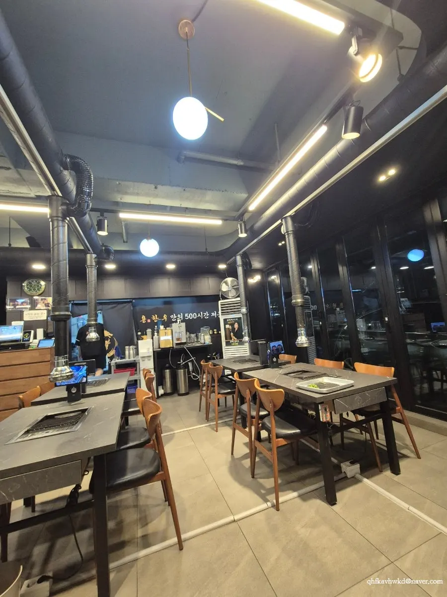 Interior of Yong Hanu Myeongji Branch with black-and-wood decor