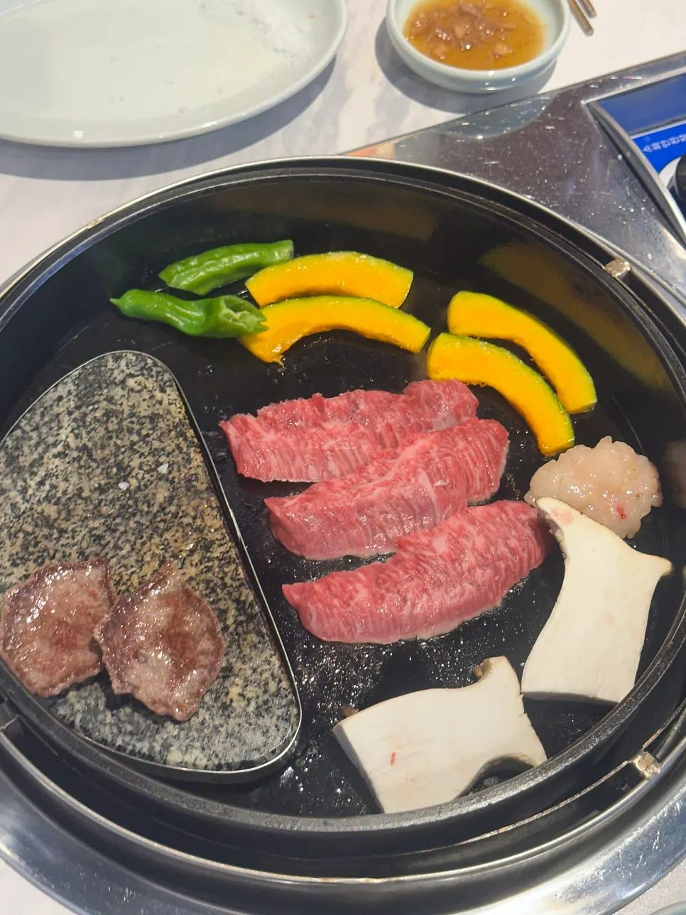 Meat served alongside the table spread