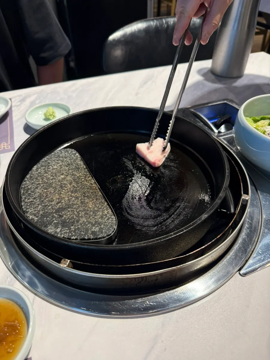 Greasing the griddle before grilling