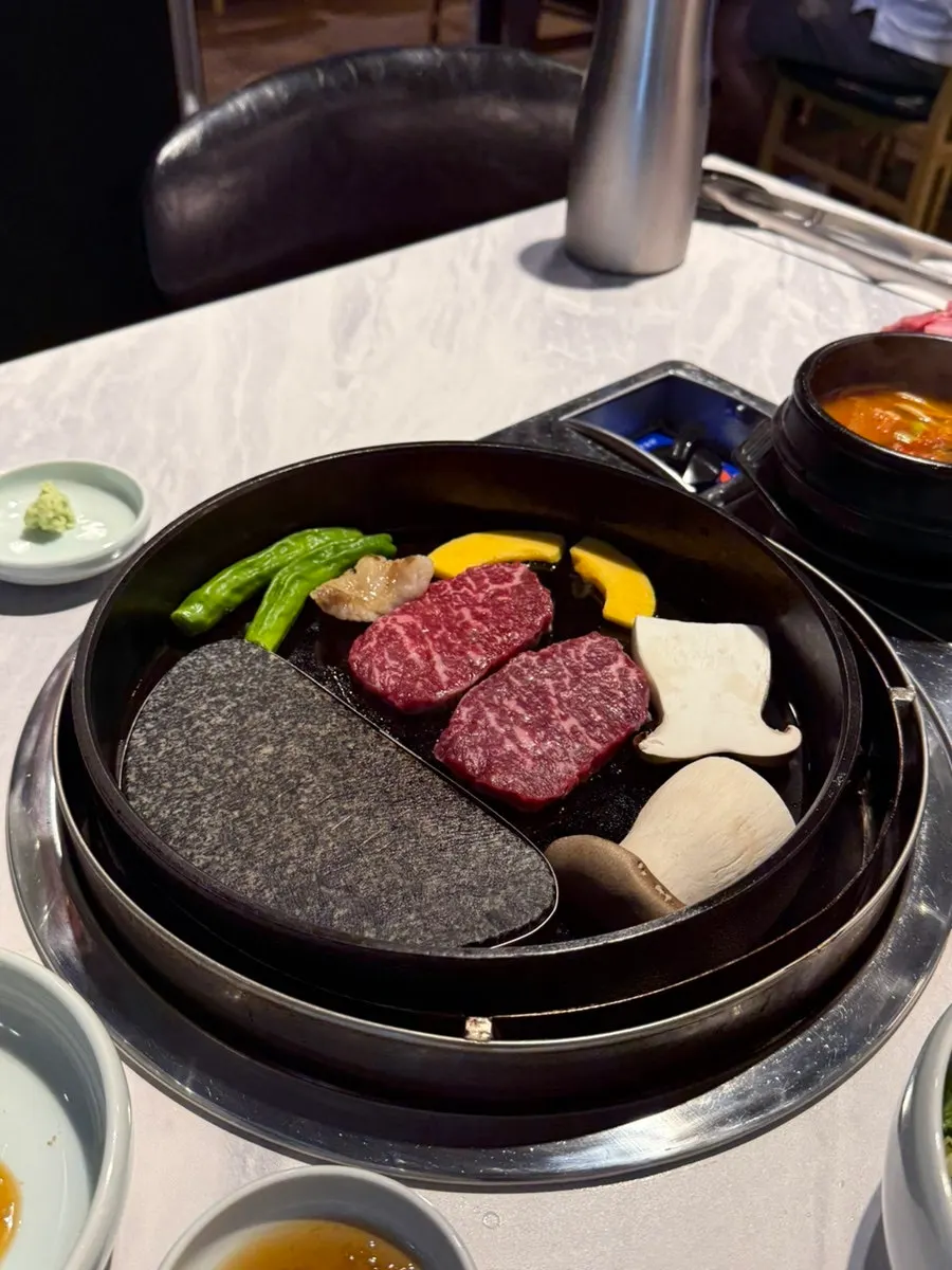 Hanwoo sirloin placed on the griddle