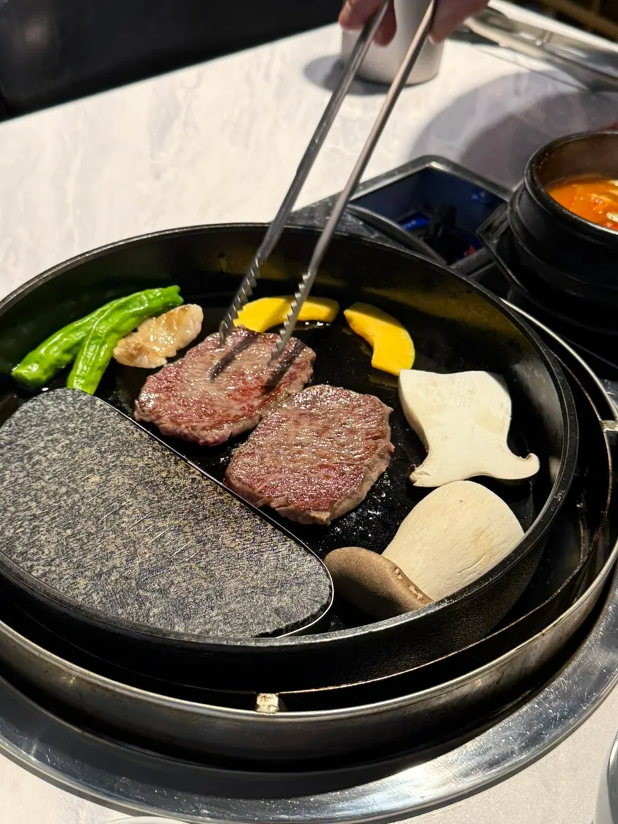 Hanwoo sirloin grilling on the griddle
