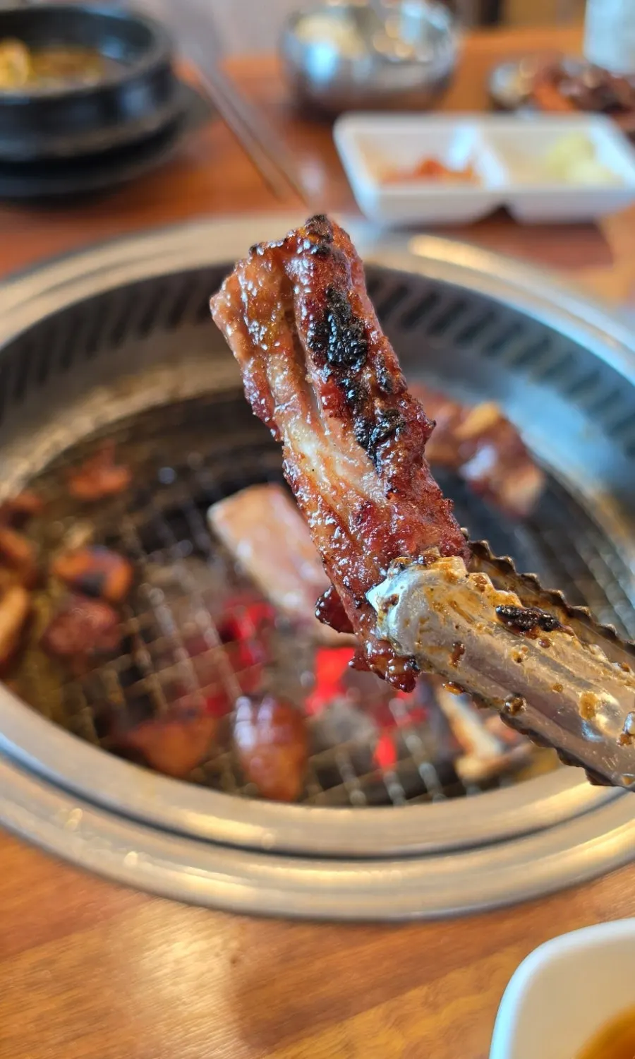 Final table setting with pork galbi, rice, and side dishes