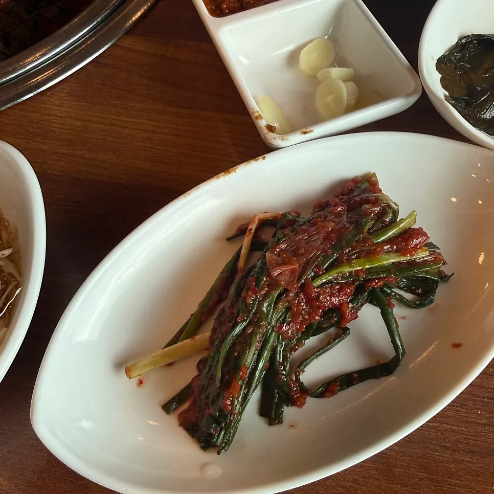 Pickled mountain garlic leaves side dish eaten with the meat