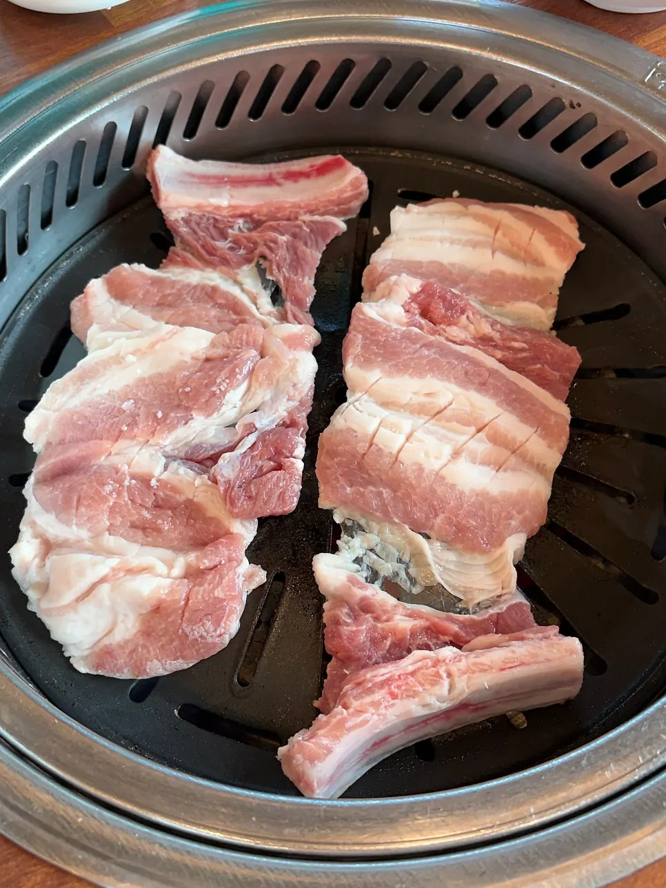 Fresh pork ribs grilling on the pan