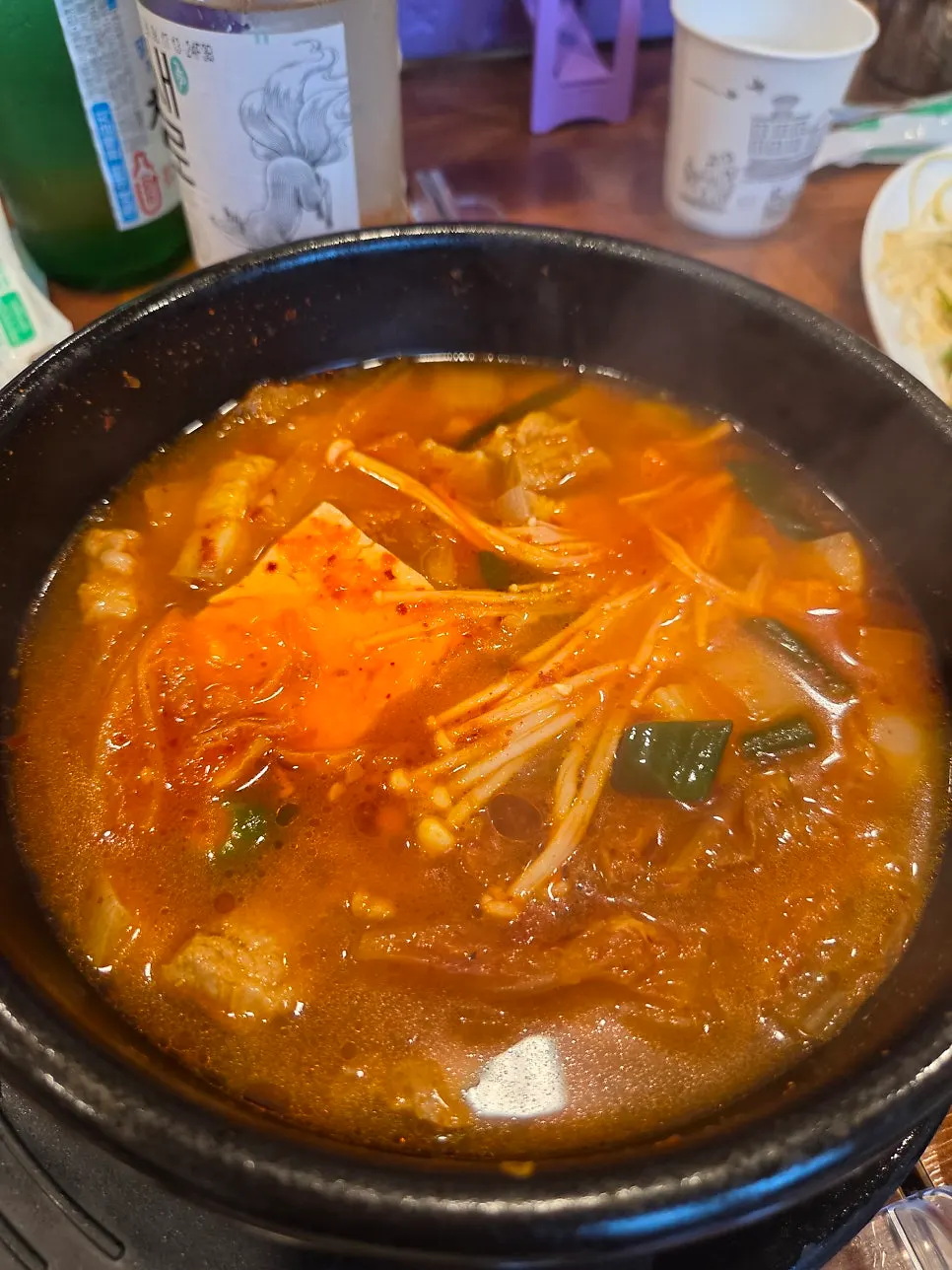 A pot of kimchi jjigae with fresh pork