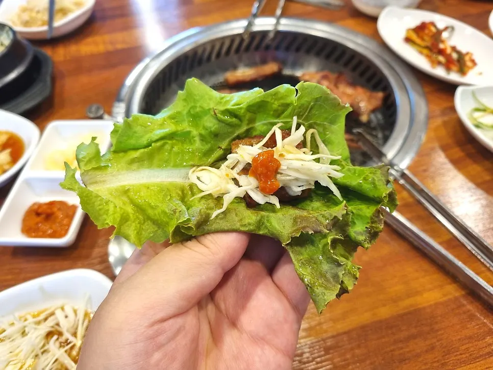 Seasoned galbi and green onion kimchi on a side plate