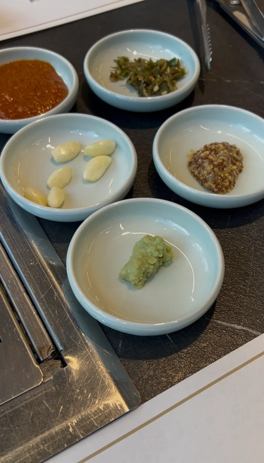 Sauce station with salt, wasabi, and whole grain mustard sauce
