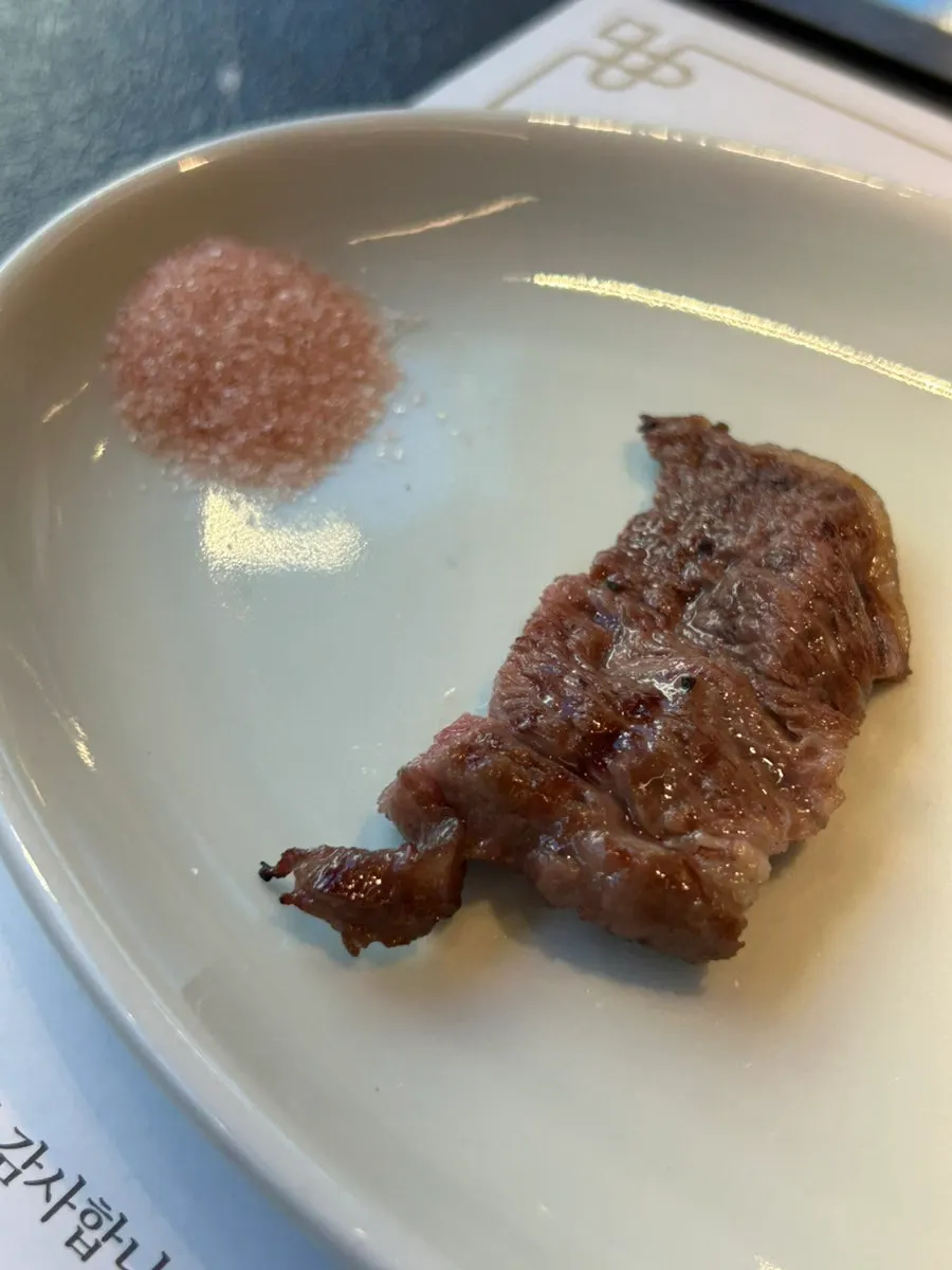 A piece of hanwoo beef dipped in salt
