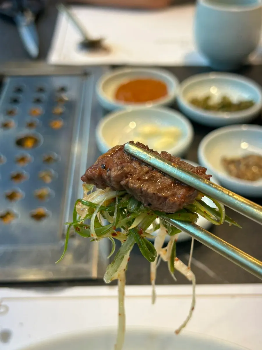 More hanwoo beef being grilled and eaten