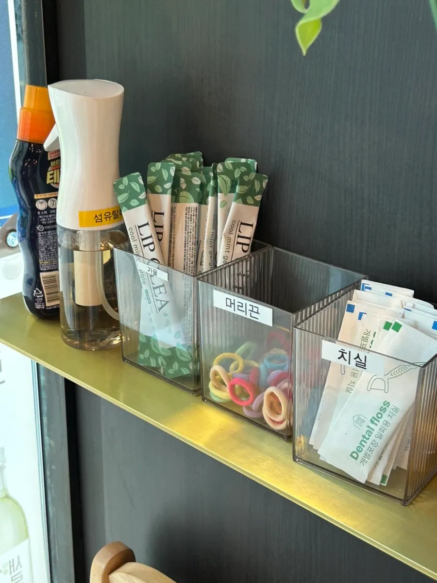 Convenience corner with dental floss, mouthwash, and hair ties
