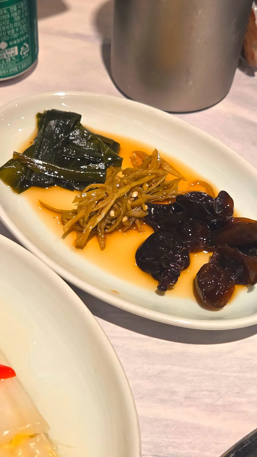 White kimchi and pickles, basic side dishes at the beef restaurant