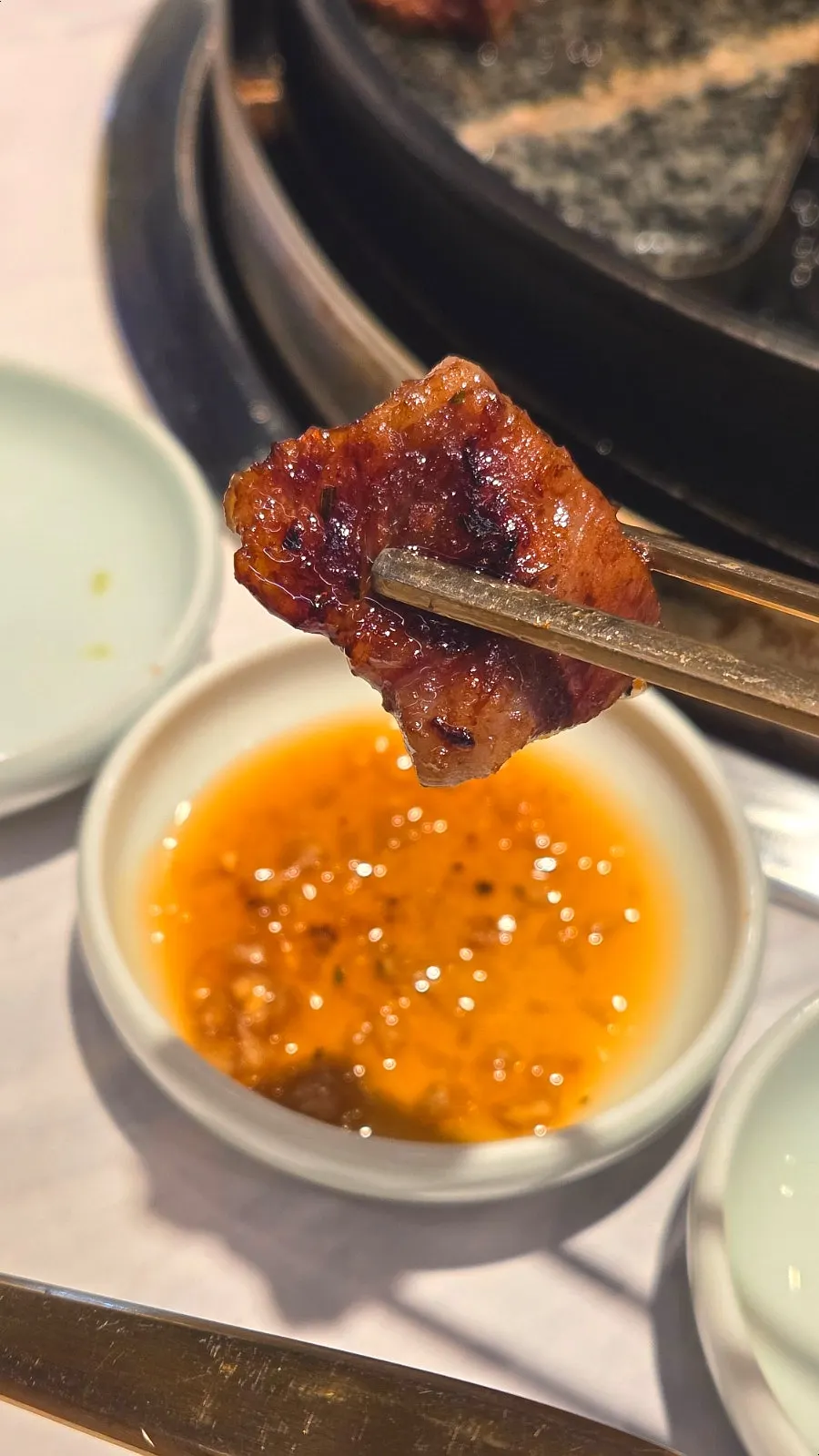 A bite-sized piece of seasoned galbi cut for eating