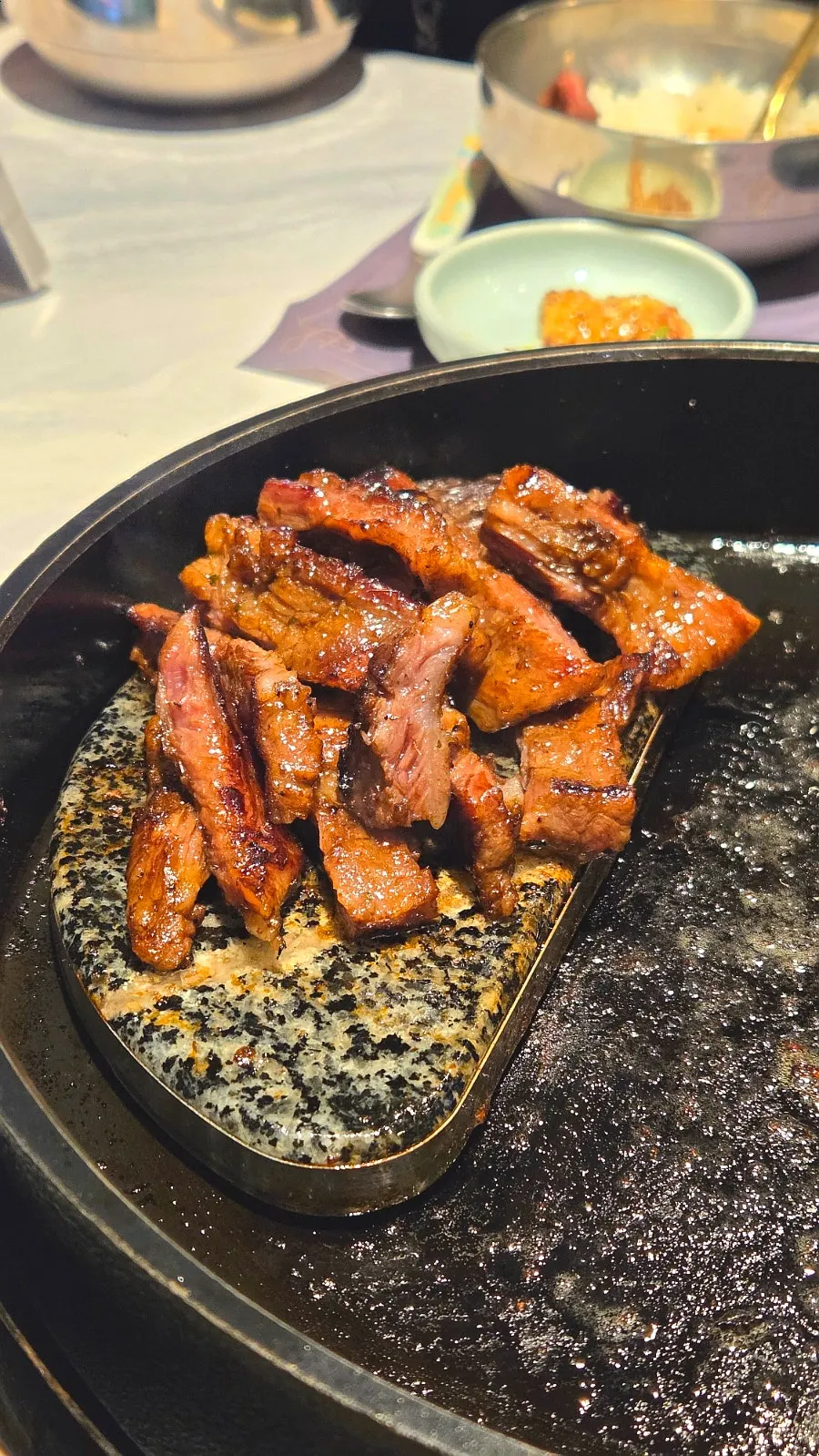 Grilled seasoned galbi set on the stone plate