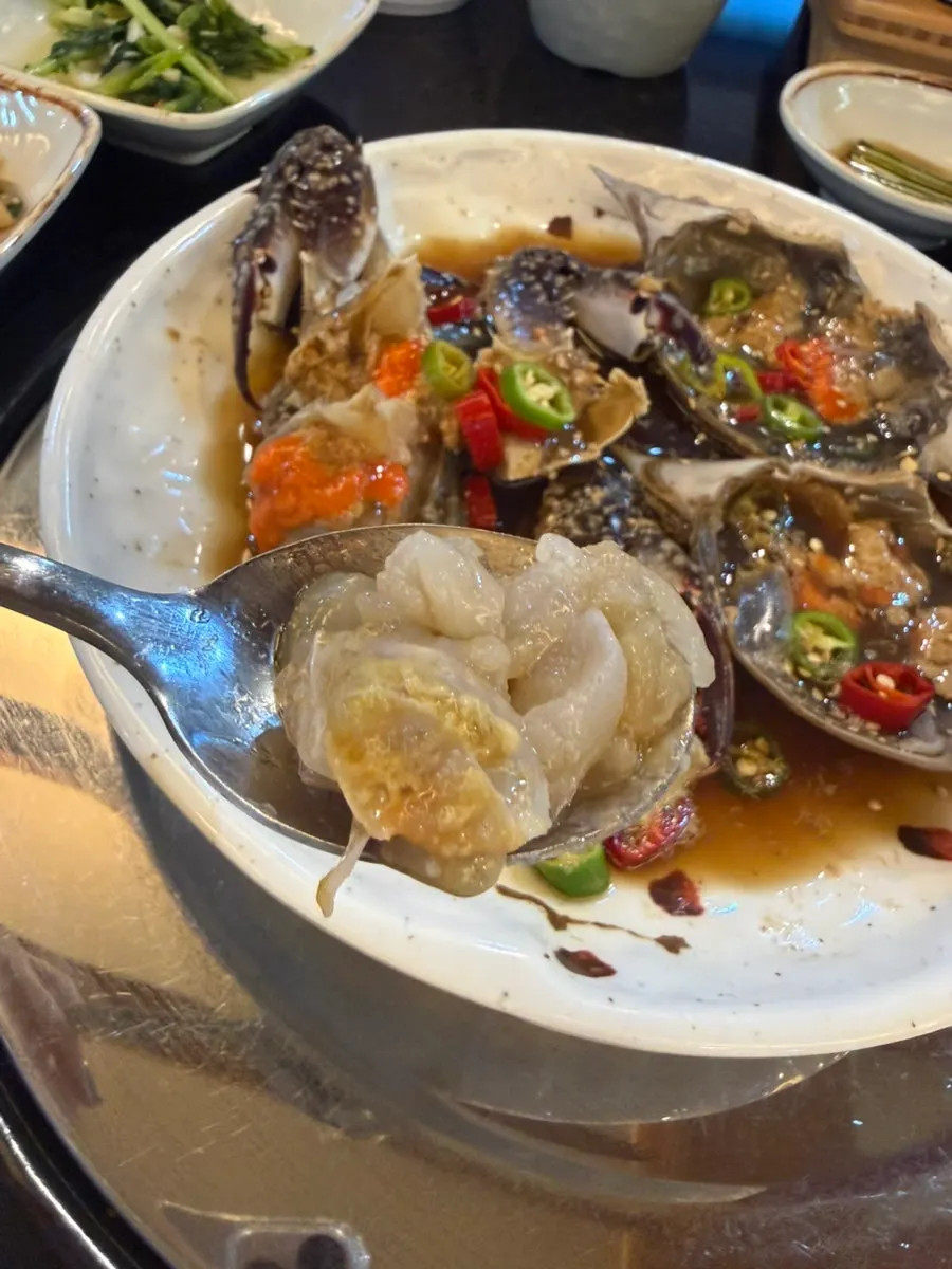 Soy-marinated crab and hot pot rice meal
