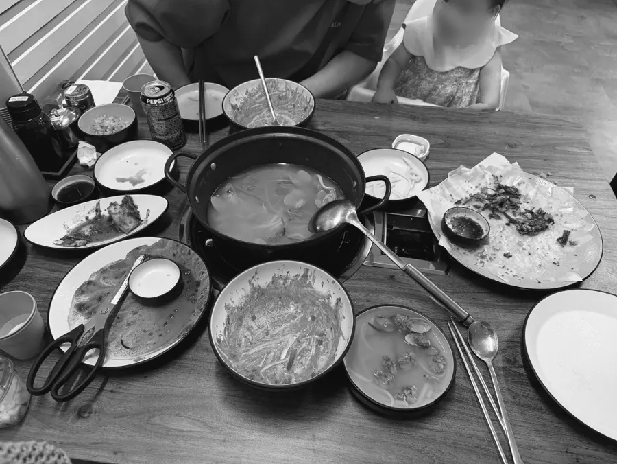 Emptied bowls of kalguksu and side dishes
