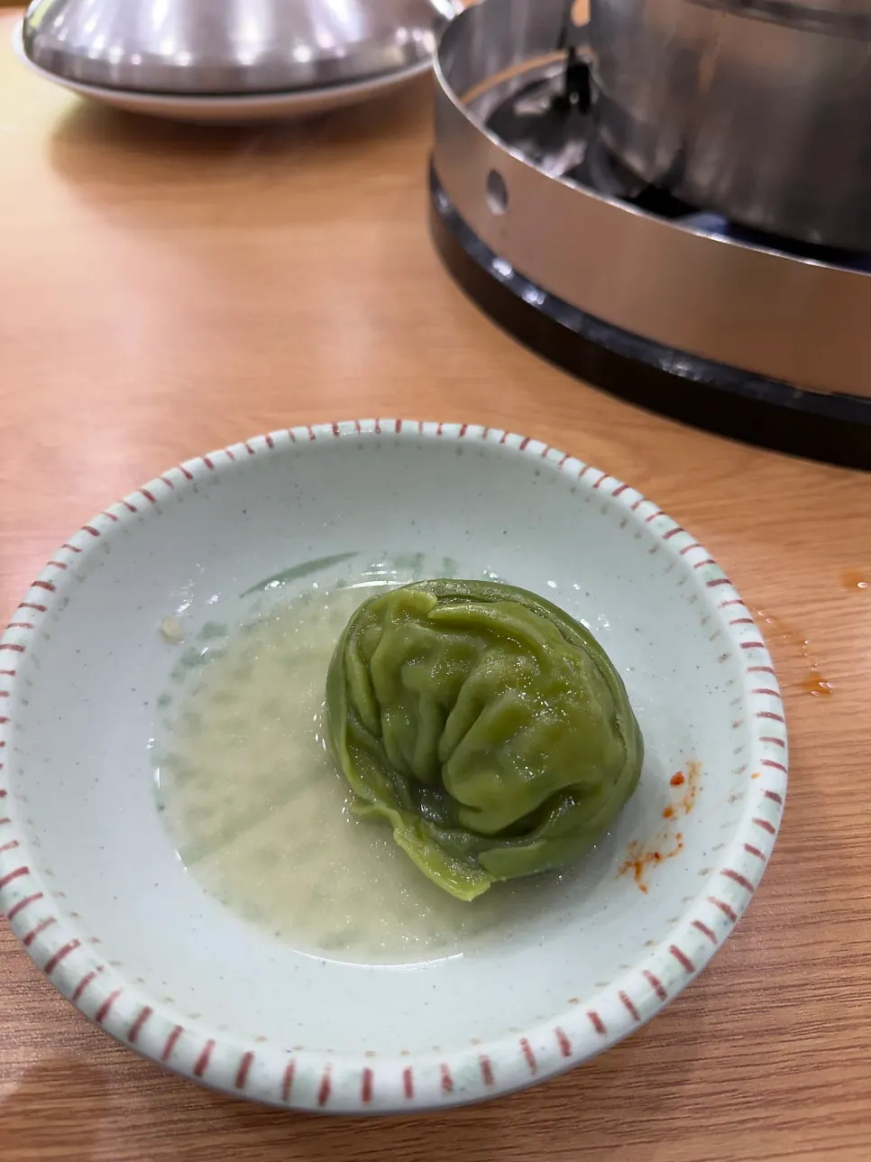 Seafood mandu jeongol for two, bubbling in the pot
