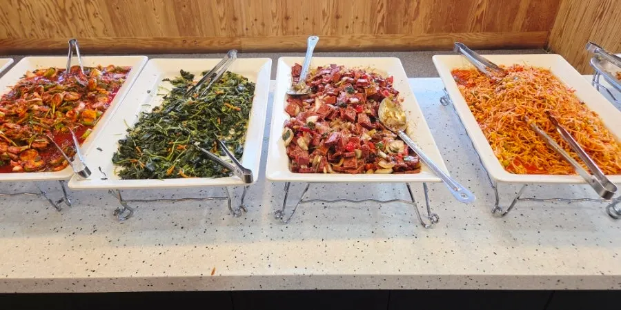 Korean buffet food station with millet rice and fried rice