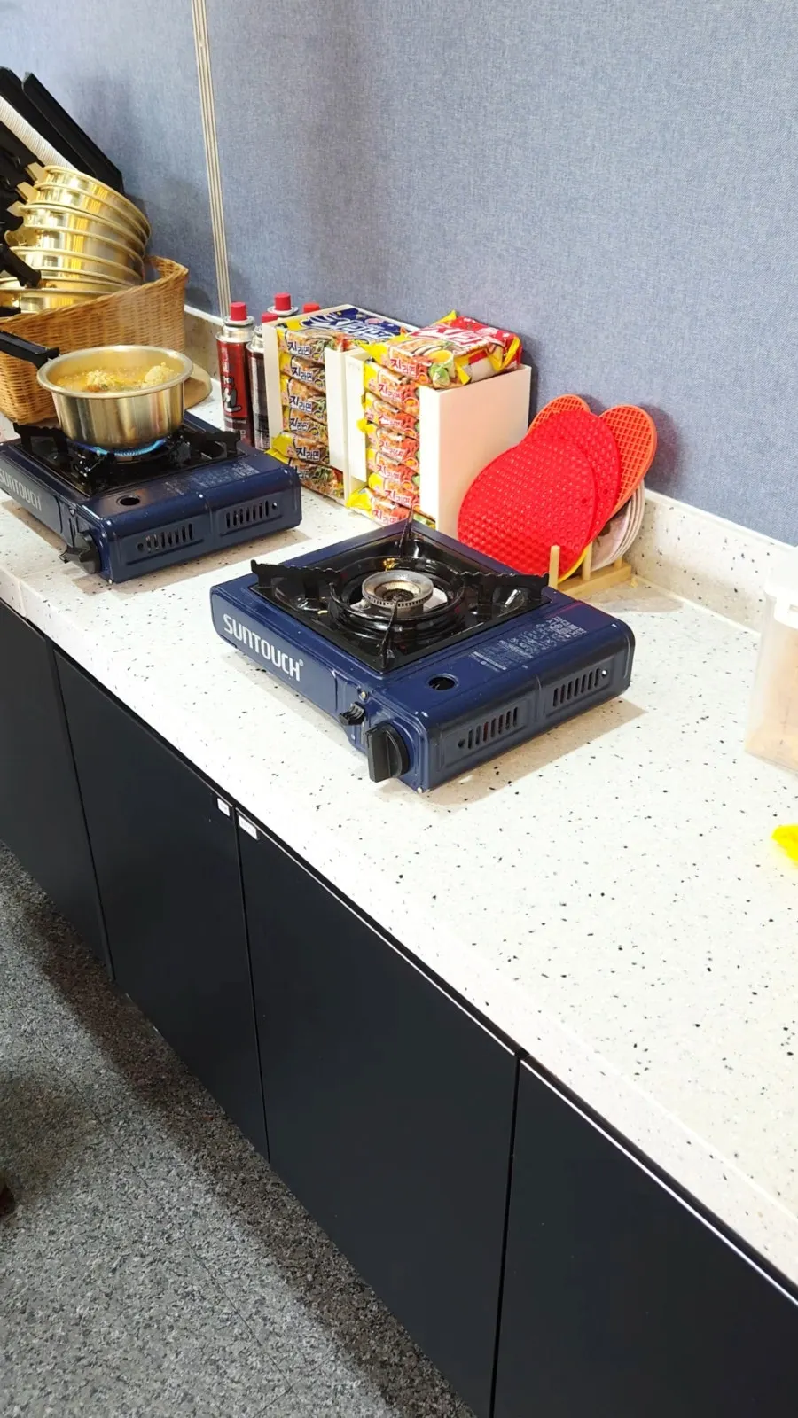 Cafeteria tray filled with various Korean side dishes