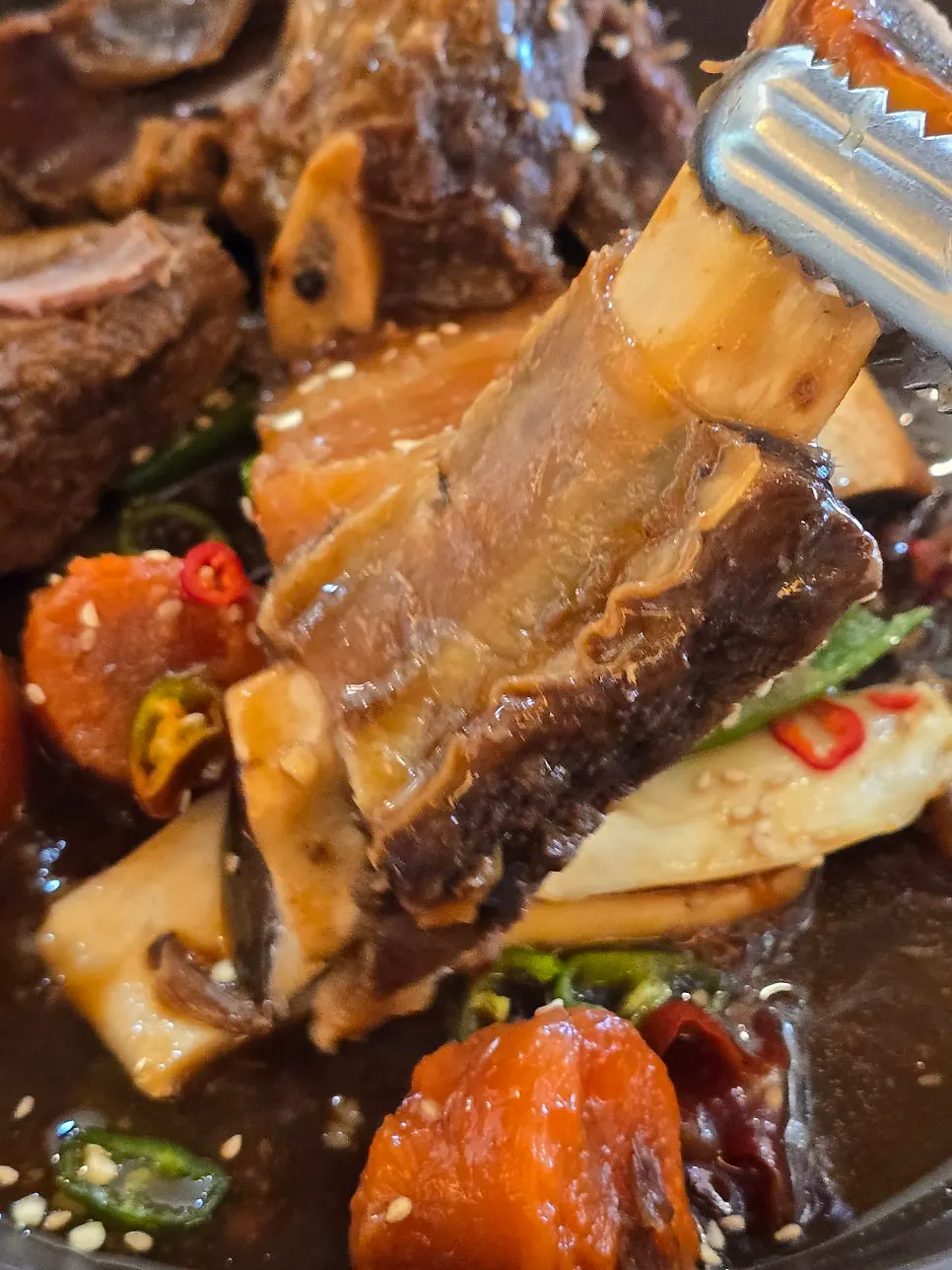 Braised beef short ribs in sweet-and-savory sauce