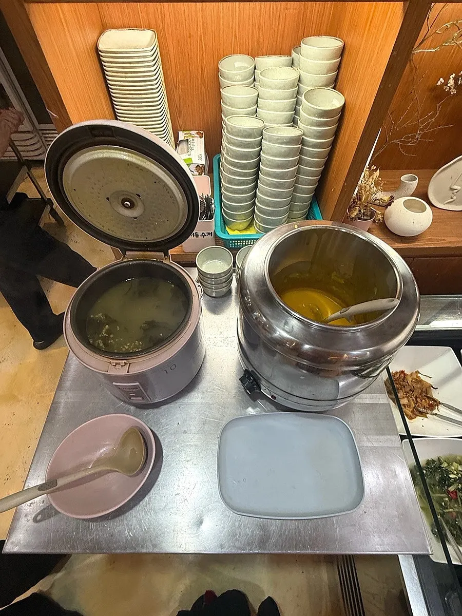 A full spread of soy-marinated female crab set meal and beef yukjeon