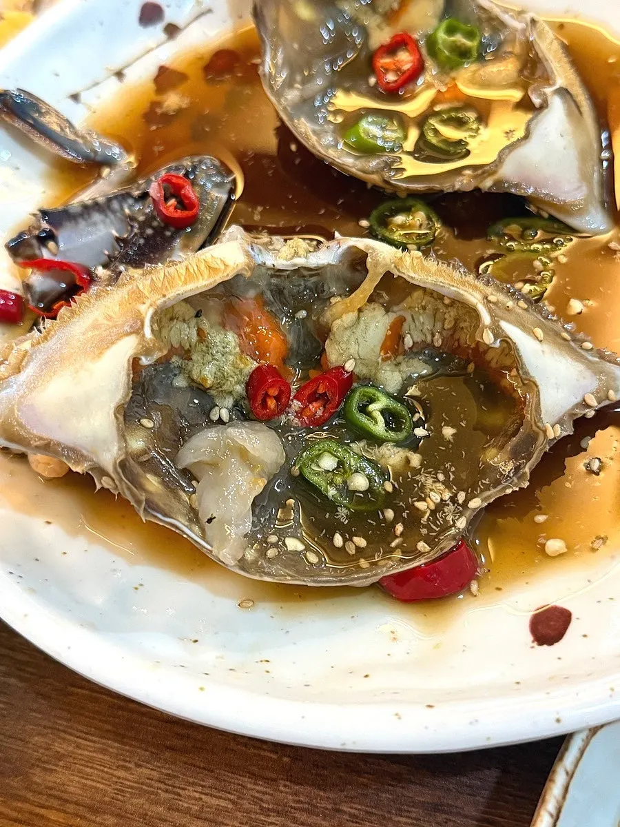 Korean side dishes enjoyed with soy-marinated crab