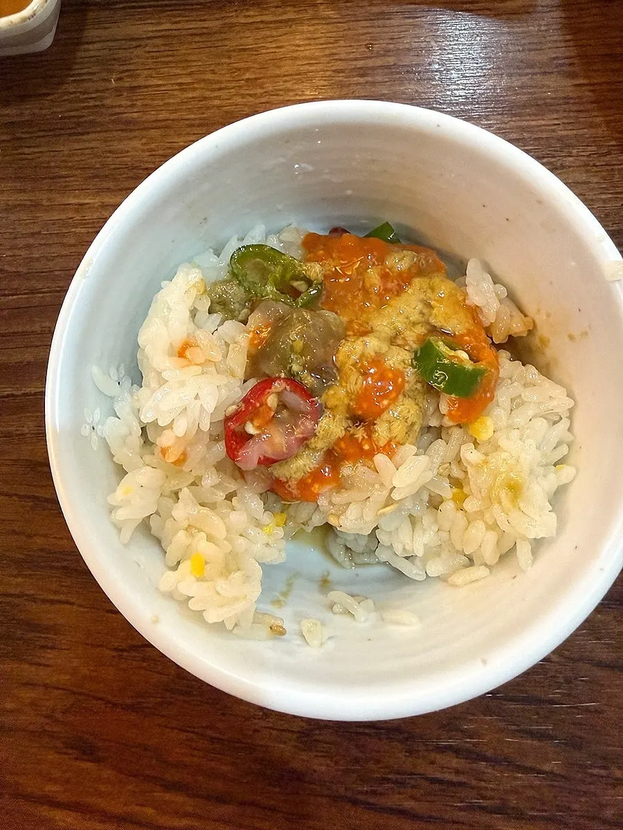 Soy-marinated crab served with roasted seaweed and white rice