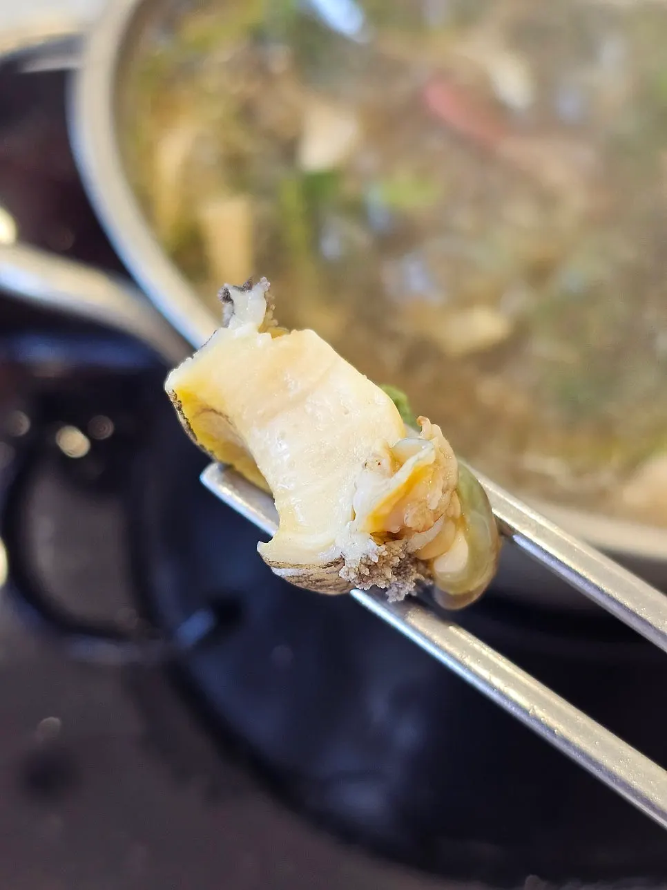 Live abalone cooked in broth