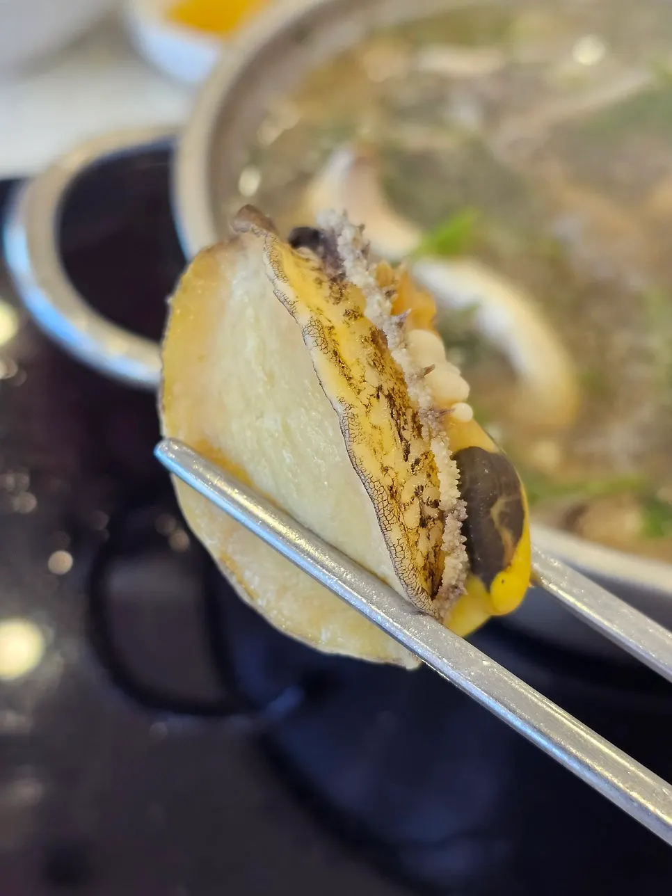 Shabu kalguksu broth with meat and abalone