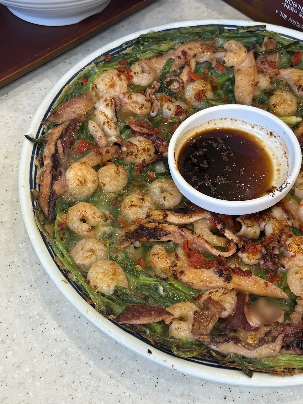 Freshly served whole shrimp seafood pancake