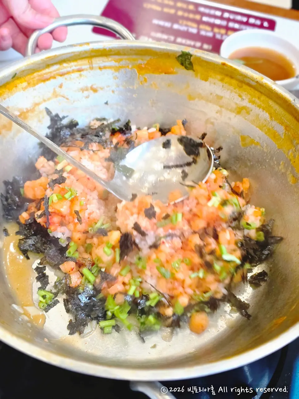 Spicy shabu broth starting to boil with beef brisket