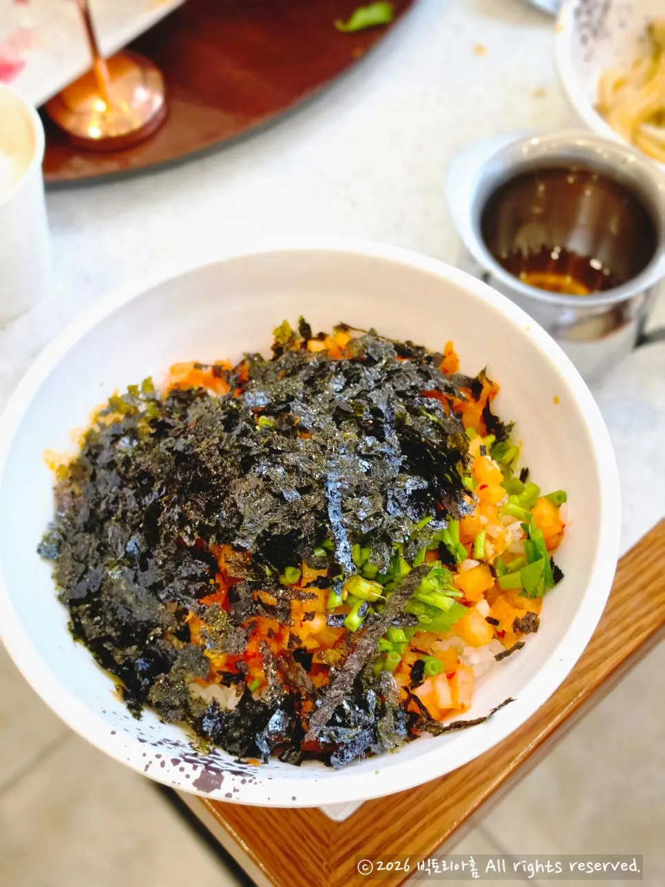 Chewy house-made kalguksu noodles lifted from the pot