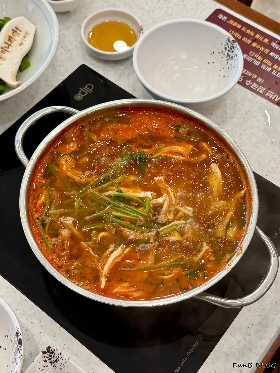 Chewy kalguksu noodle strands cooked in the broth