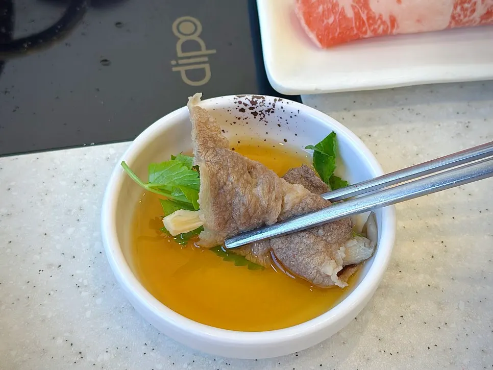 Wrapping minari over chadol beef to make a ssam