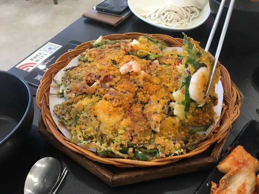 Cross-section of the seafood pancake showing large shrimp