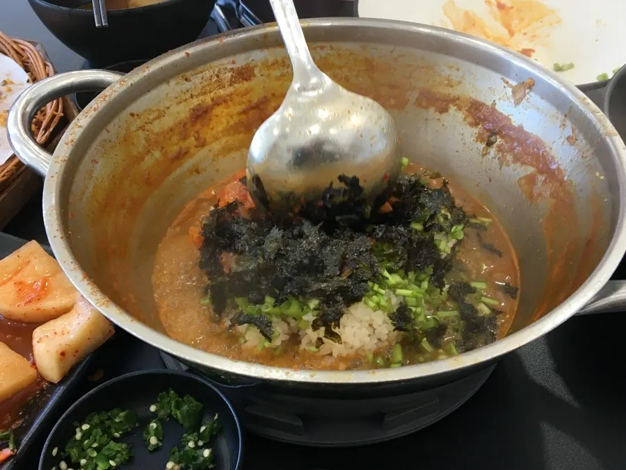 Kalguksu noodles added into the broth