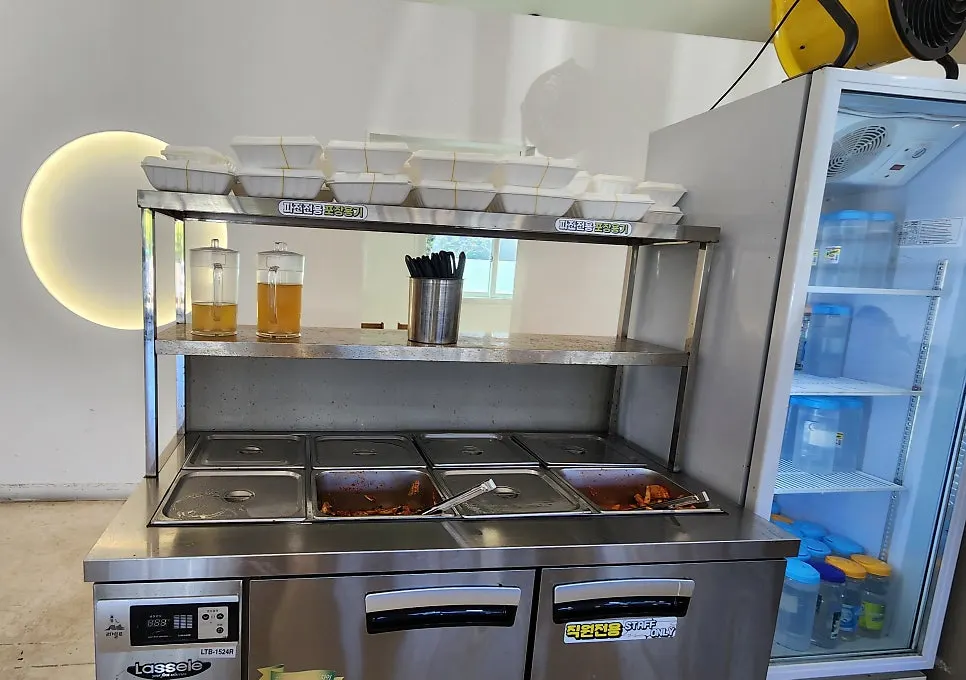 Self-serve bar with broth, geotjeori, and mu kimchi