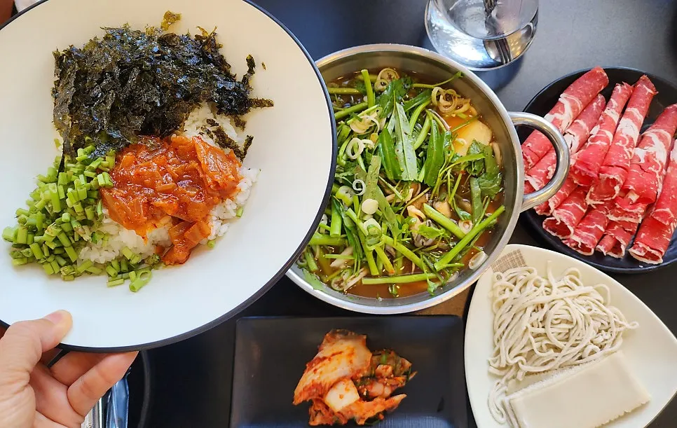A vegetable-packed shabu-kalguksu spread for two