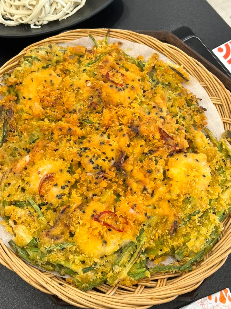 Cross-section of the seafood pancake with large shrimp