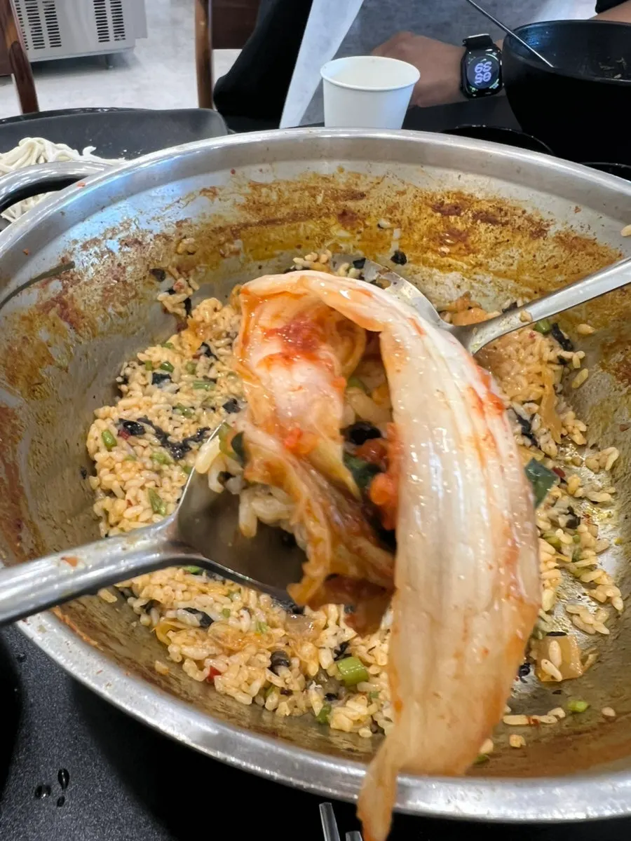 Scooping up a spoonful of fried rice