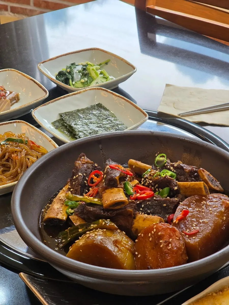 Full table spread of braised beef short rib at Sotbap Hansang