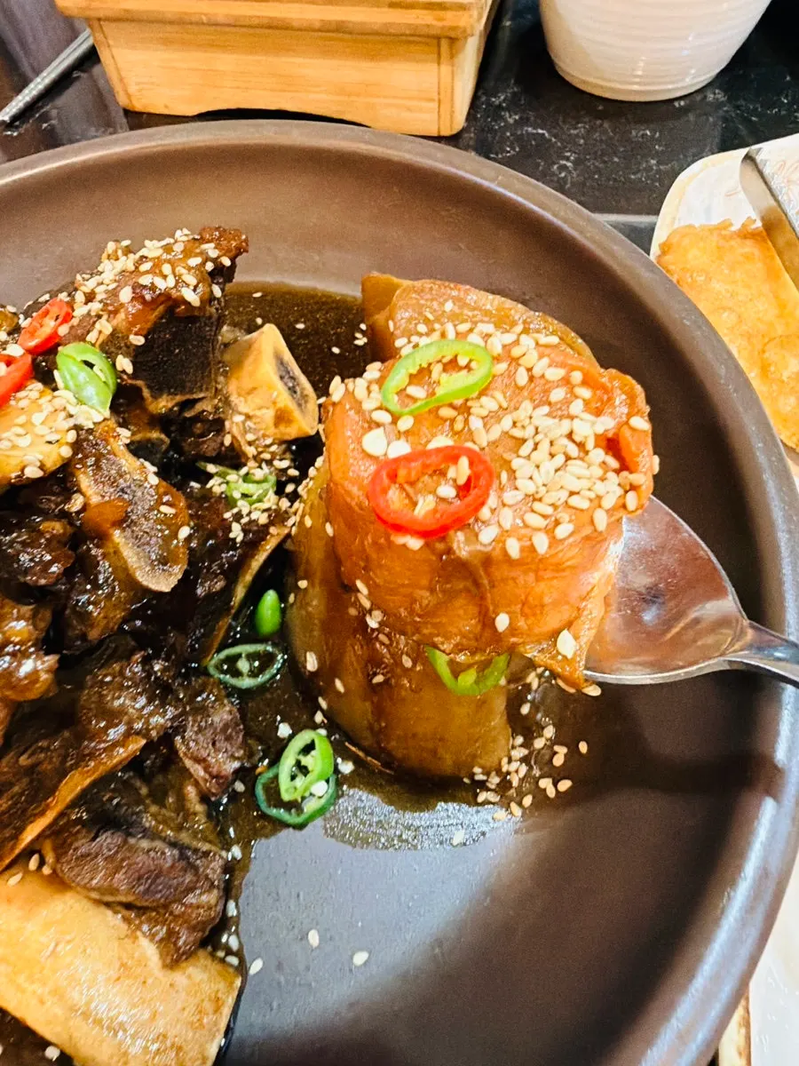 Warm pot rice served with the braised short rib