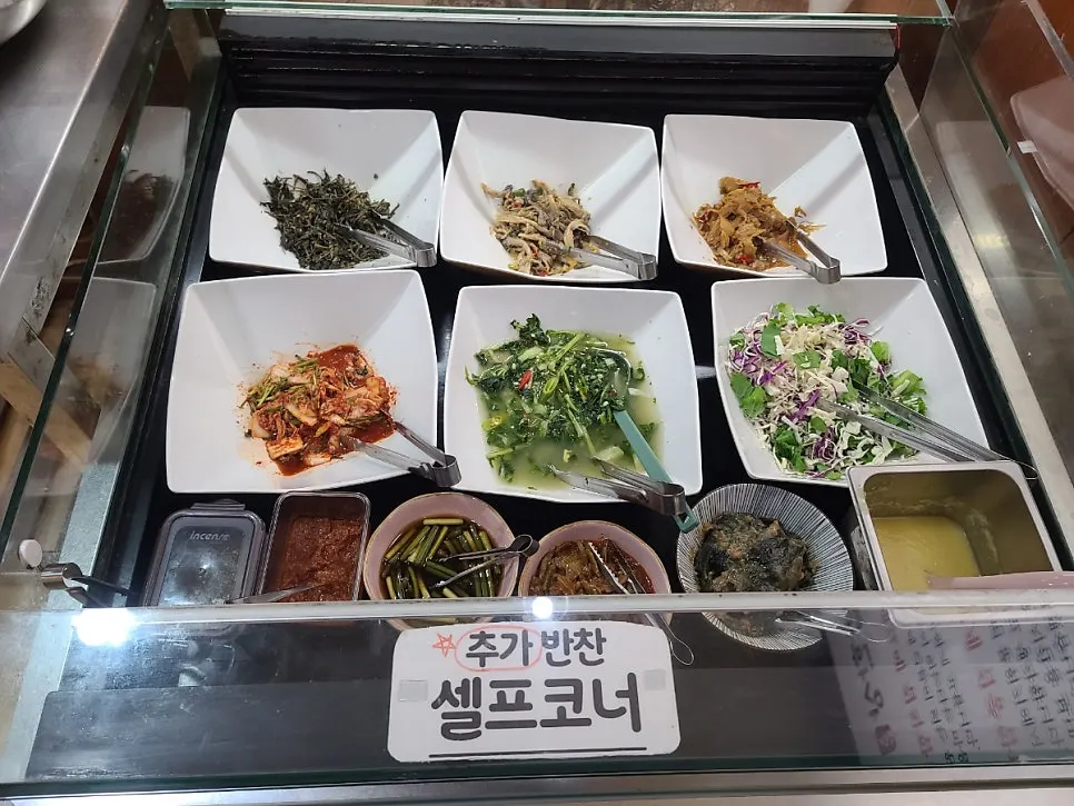 Self-service corner with side dishes, porridge, and soup