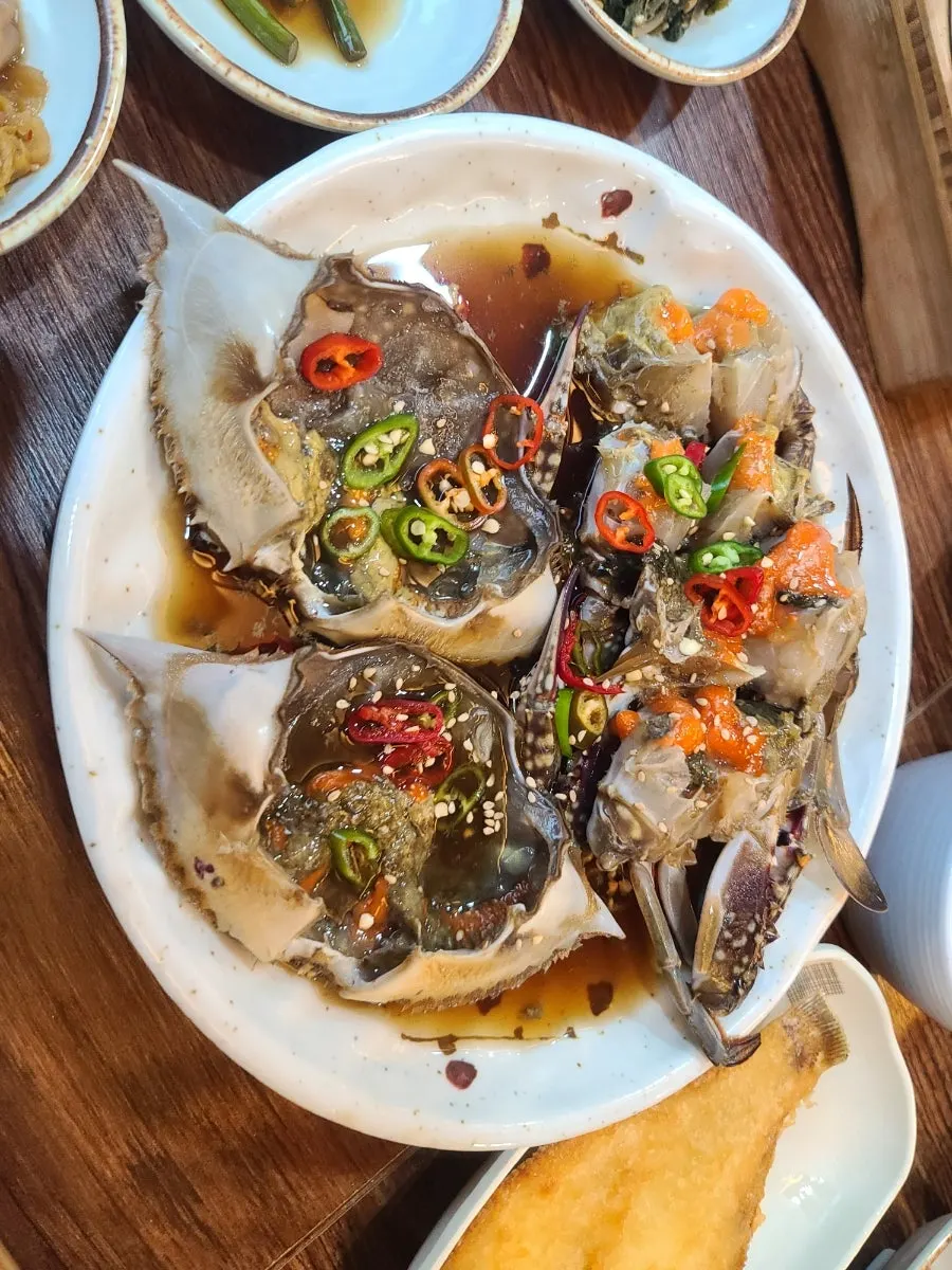 Plate of female crab soy-marinated crab with roe-filled shell