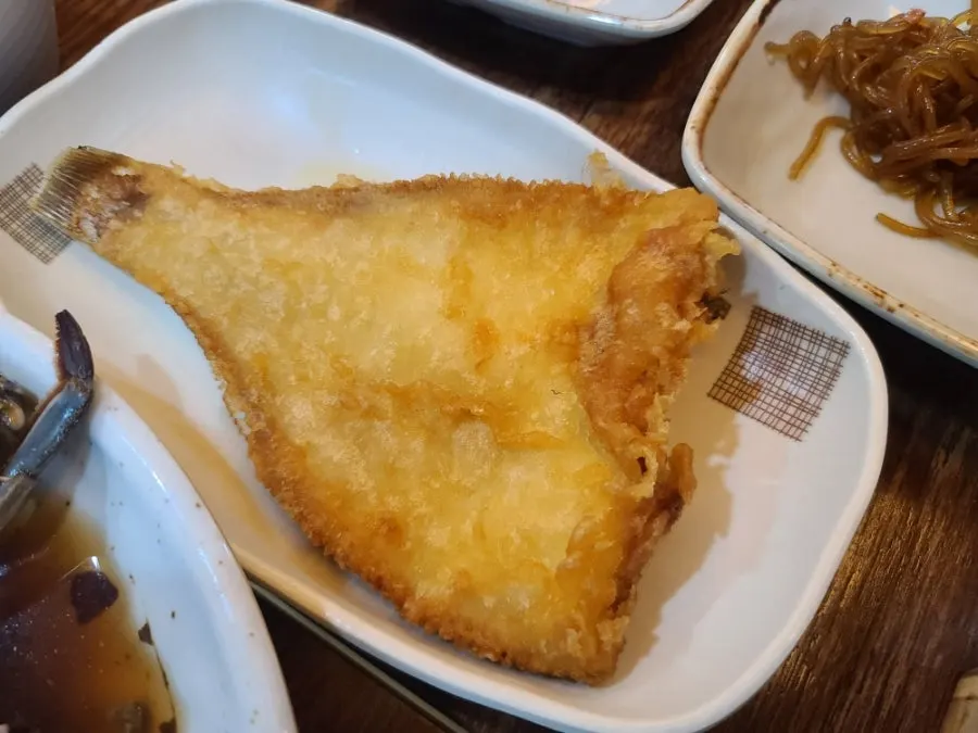 Full spread with soy-marinated crab, grilled flounder, and sotbap