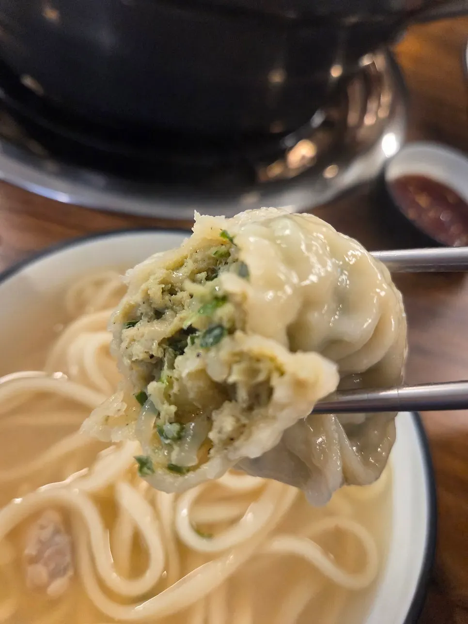 Four giant meat dumplings eaten with a child