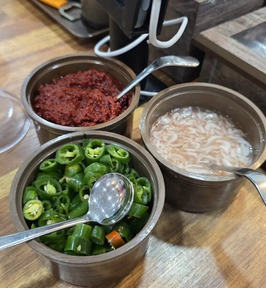 Cheongyang chili peppers, salted shrimp, and seasoning on the table