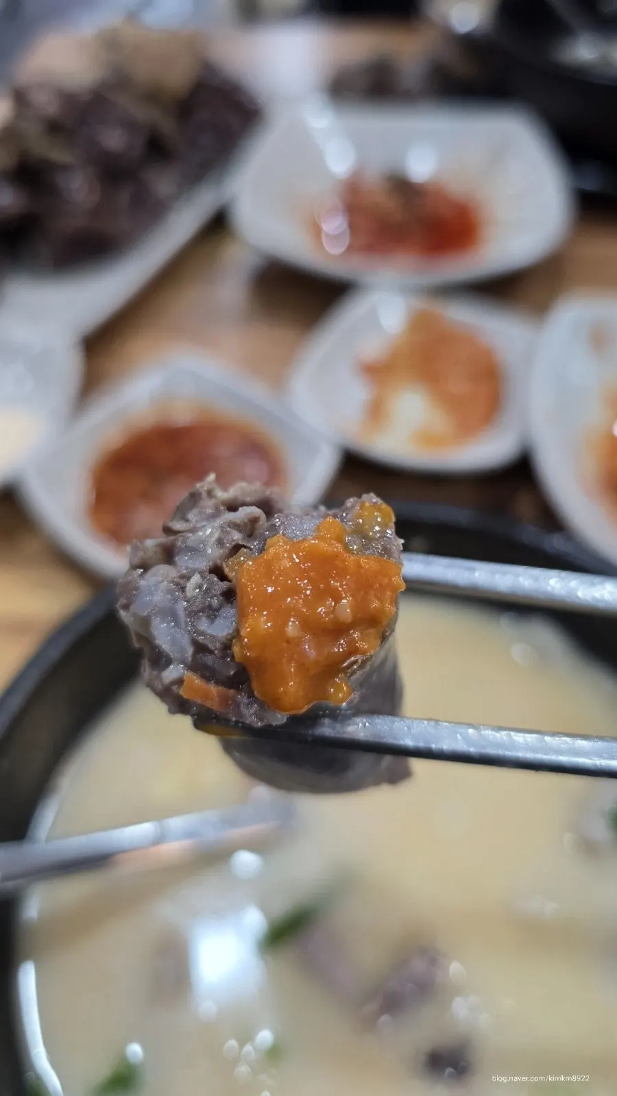 Eating sundaeguk with rice mixed in