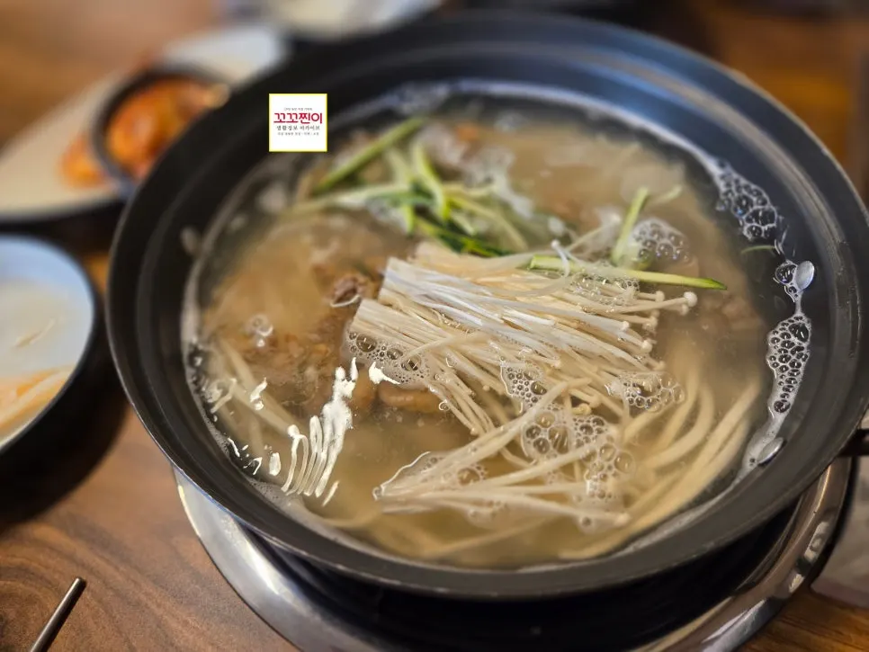 A steaming bowl of pufferfish seafood kalguksu served hot