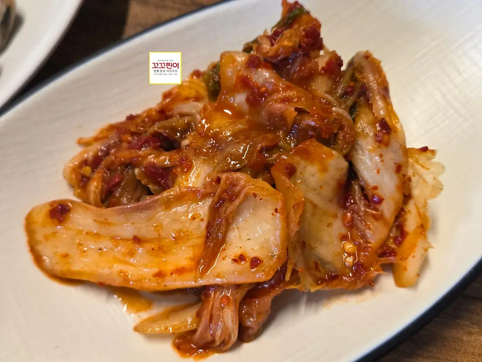 A scoop of chewy kalguksu noodles lifted from the bowl